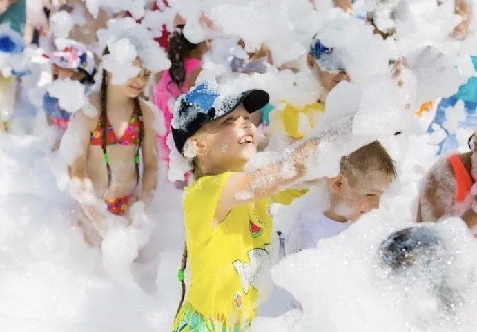 Boy playing in foam